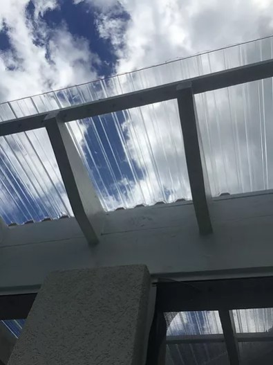 PATIO ENCLOSURE WITH CORRUGATED ROOF