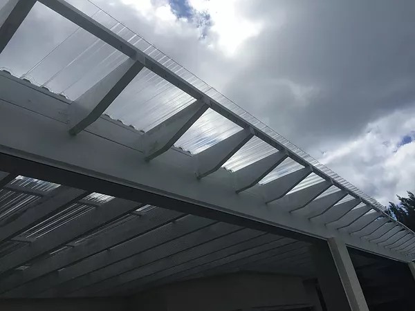 PATIO ENCLOSURE WITH CORRUGATED ROOF