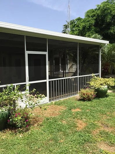 PATIO ENCLOSURE WITH INSULATED ROOF & PICKET SYSTEM